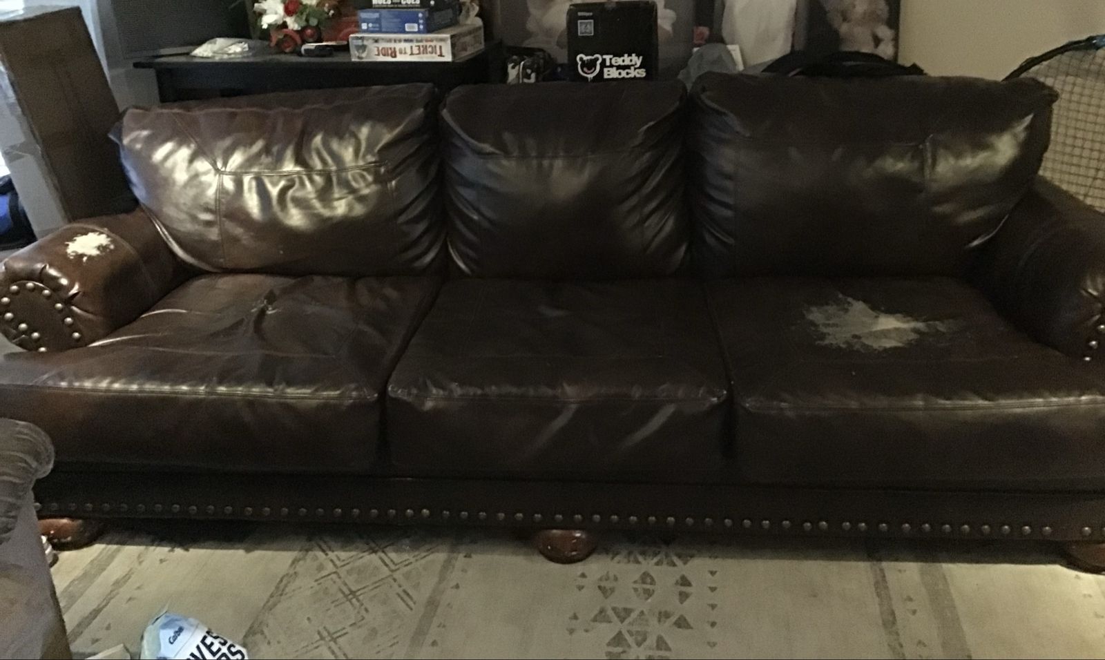 Dark Brown Vinyl Sofa with Nailhead Trim and Wear