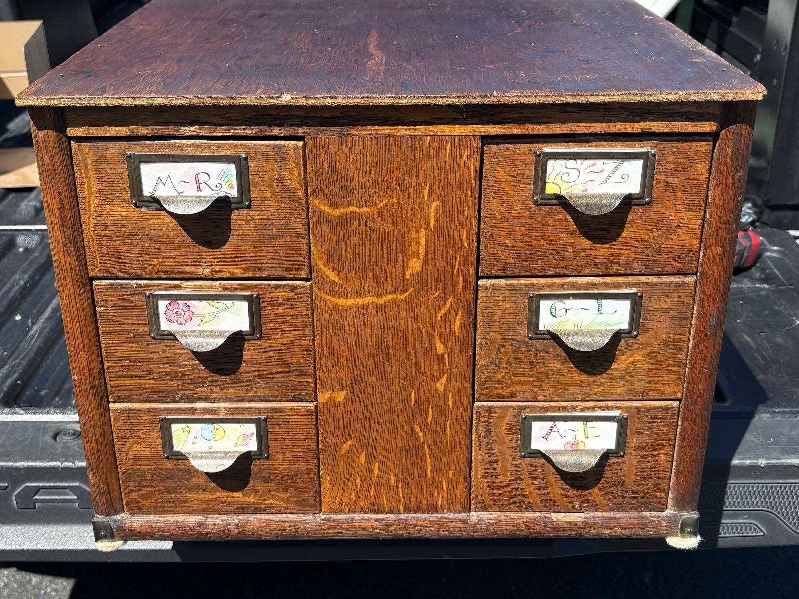 Antique quarter-sawn tiger oak filing cabinet w/ six drawers w/ original metal label holders