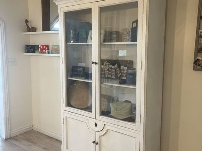 White Wooden Display Cabinet with Glass Doors and Storage Base