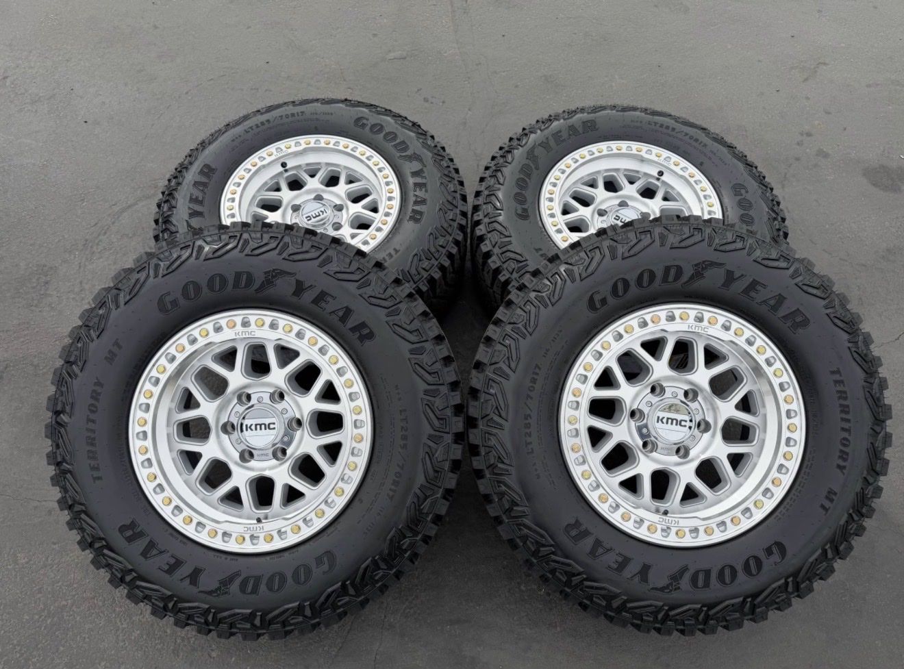 New 285/70r17 Goodyear Territory MT Silver KMC KM549 GRS 6x135 Ford F150 Expedition 6 lug 549 wheels and tires