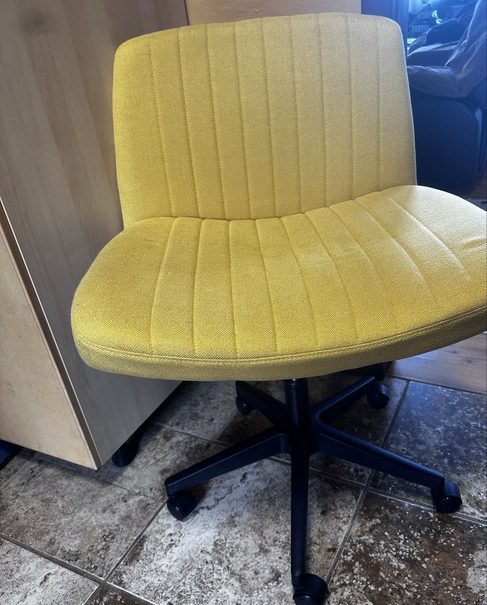Modern Yellow Tufted Fabric Rolling Office Chair with Black Base.