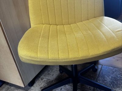 Modern Yellow Tufted Fabric Rolling Office Chair with Black Base.