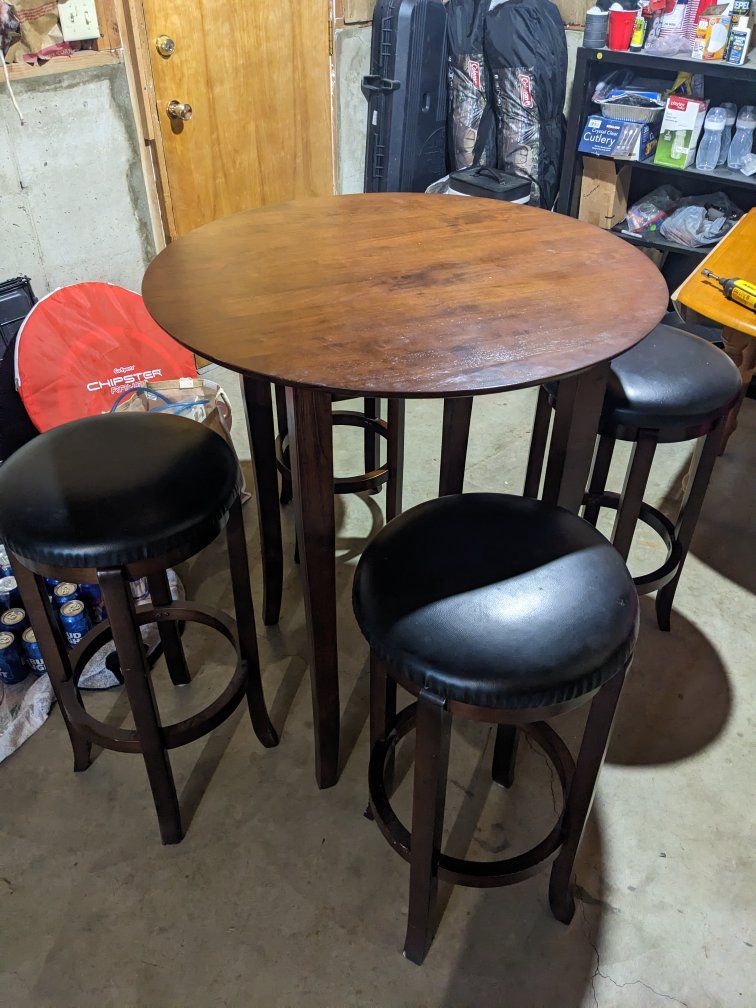 Round Pub Table with Four Black Leatherette Barstools - Dark Wood Finish