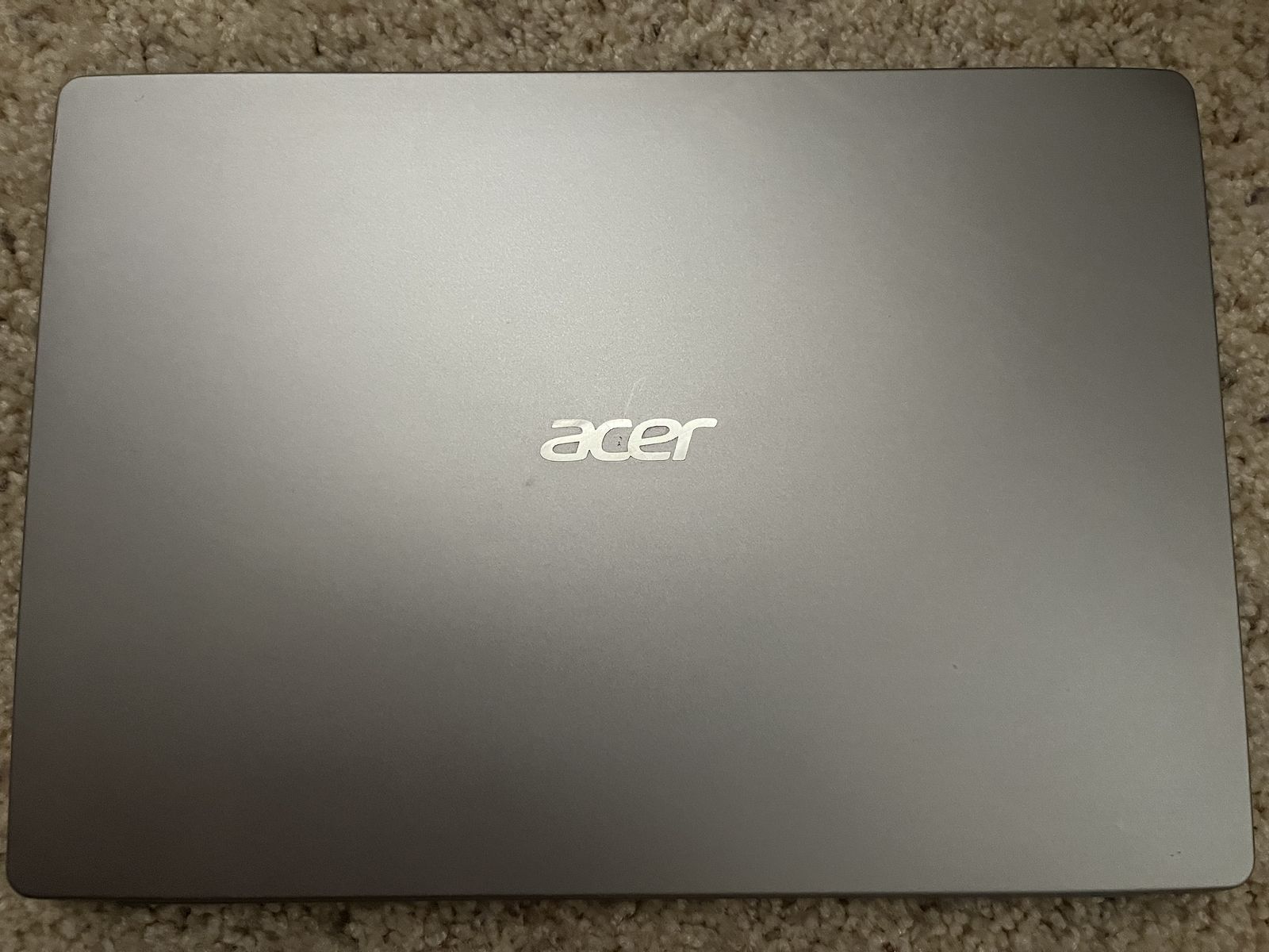 Acer Swift SF114-32 laptop with an Intel Pentium Silver N5000 processor, 4GB RAM, and 58GB storage.