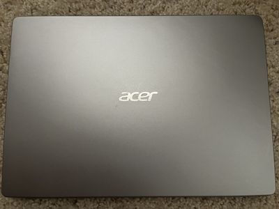 Acer Swift SF114-32 laptop with an Intel Pentium Silver N5000 processor, 4GB RAM, and 58GB storage.