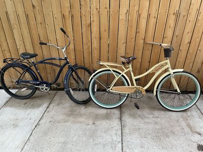 Pair of Retro Cruiser Bikes - Men's Blue Delmar & Women's Cream Panama Jack, 26" Wheels, Basket & Rack
