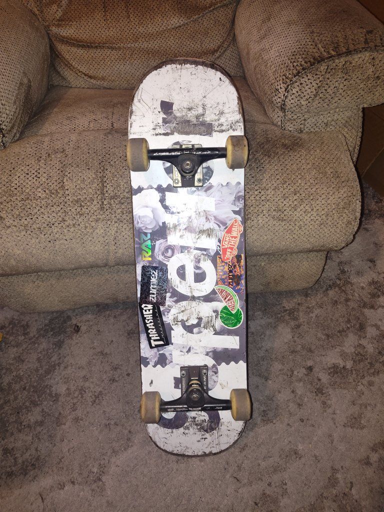 Skate Mafia Skateboard with Thunder Trucks Reds Bearings Used