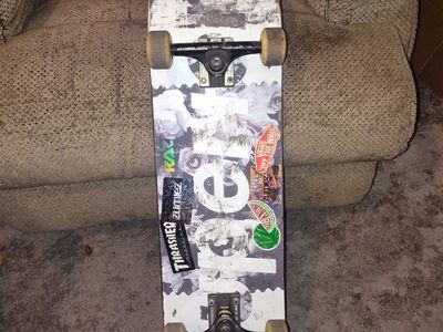 Skate Mafia Skateboard with Thunder Trucks Reds Bearings Used