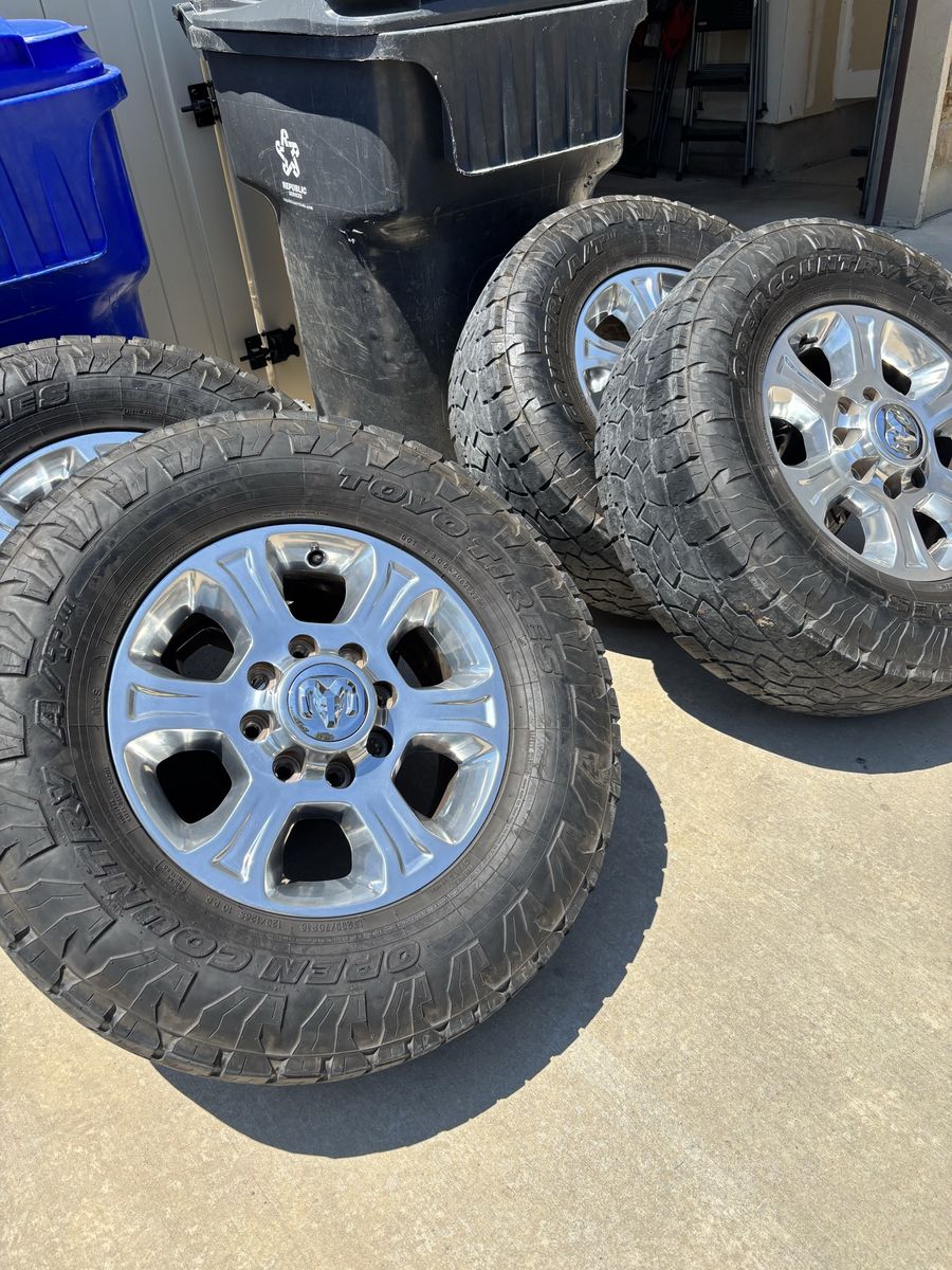 Set of 4 Toyo Open Country A/T 295/70 r 18 with chrome wheels