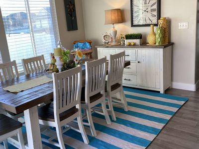 Farmhouse table, 8 chairs, and matching buffet hutch.