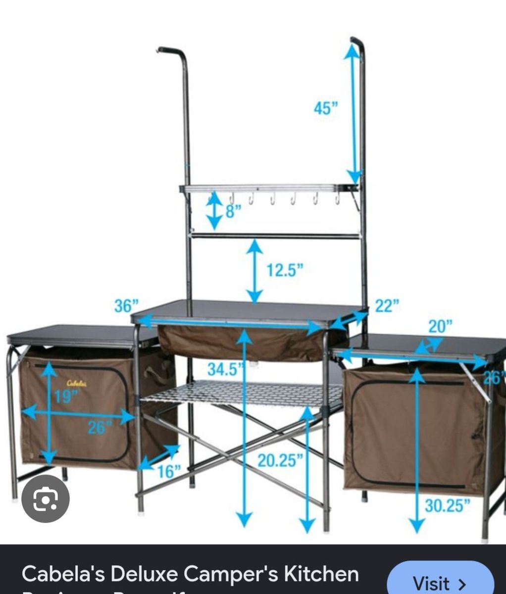 Cabela's Deluxe Camper's Camping Camp Kitchen Portable Outdoor Cooking Station
with Sink, Organization Storage Shelves, and bag.