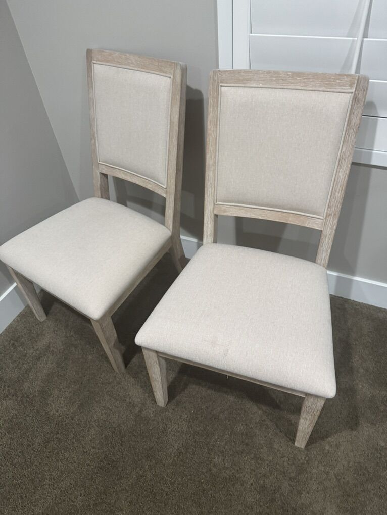 2 Chairs - light colored wood w/ Tan fabric seats
