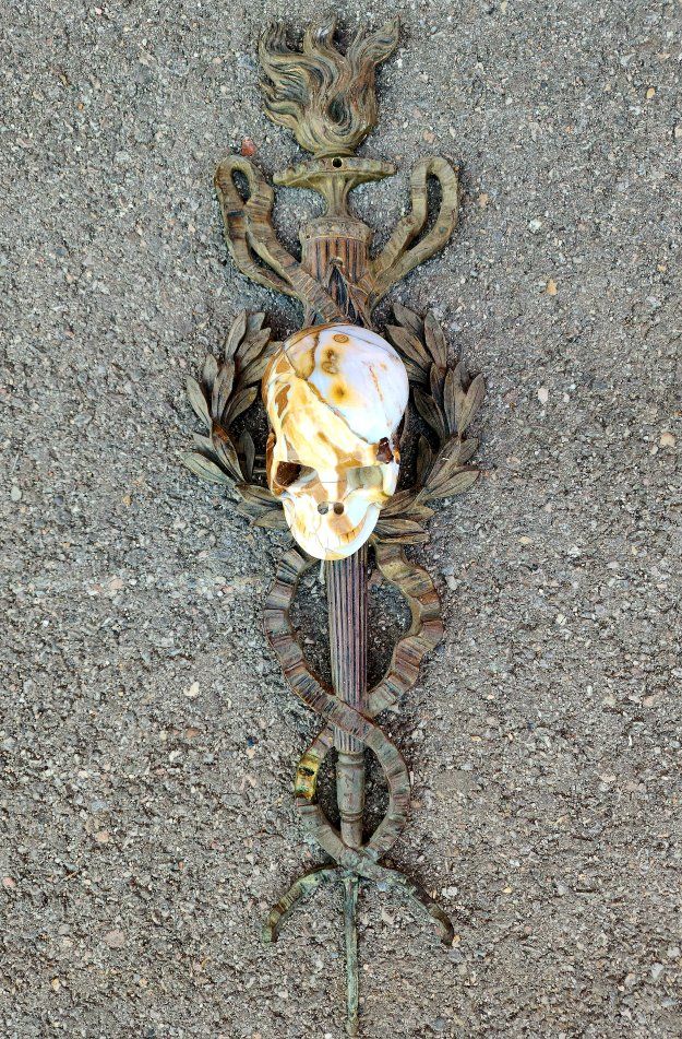 Vintage Metal Wall Sconce Scepter with Carved Stone Skull Accent