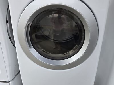 LG washer and dryer with pedestals and instruction manuals