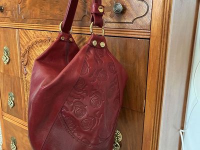 Marino Orlandi Italian Leather Sling Bucket Bag with Embossed Floral Detail in Burnt Red
