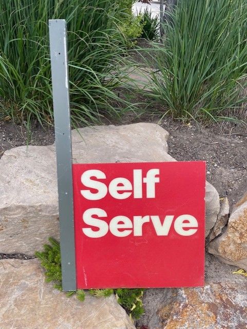 Self Serve Gas Station sign