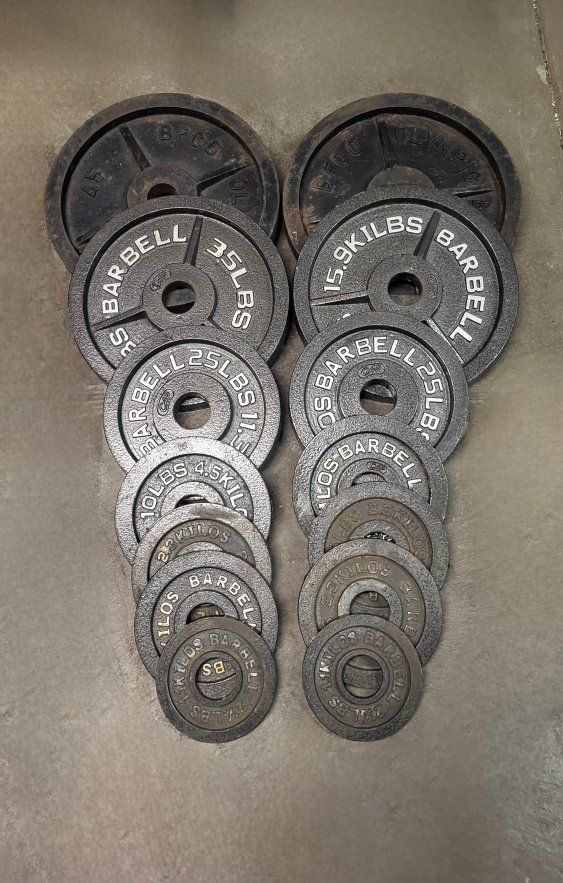 255 pounds of Olympic weights