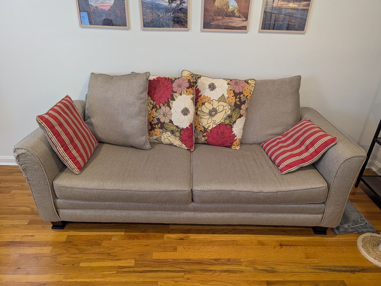 Stylish sofa with floral accent pillows