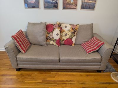 Stylish sofa with floral accent pillows