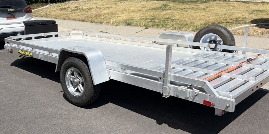All aluminum 2022 7x14 trailer Aluma heavy duty trailer utility flat bed with spare tire. Like new