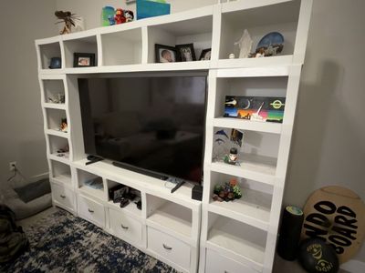 White Wood Entertainment Center TV Stand, with two side sections and a top section with Shelves & Drawers
