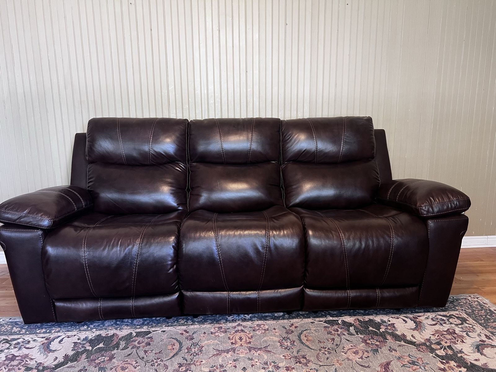 Dark Brown Leather Reclining Sofa with Plush Pillowed Back