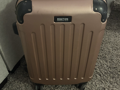 Gently used carry-on luggage w/ four roller wheels