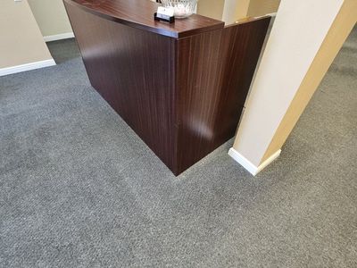 Dark Wood Grain Reception Desk Counter
