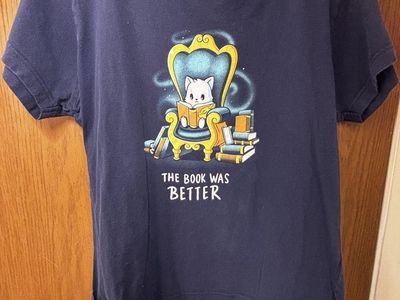 Teeturtle "The Book Was Better" Cat Reading Graphic Tee - Women's Blue T-Shirt, Size M
