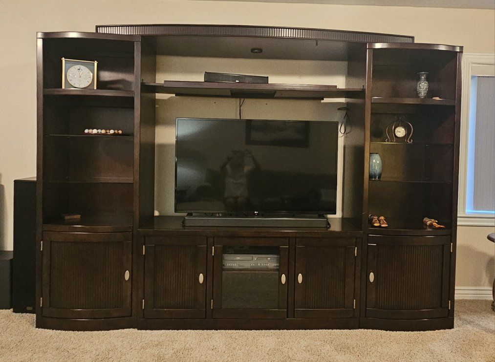 Large Dark Wood Entertainment Center with Display Shelves and Storage Cabinets