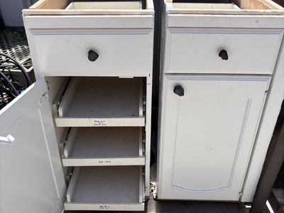 Pair of Base cabinets each have 3 pull out storage drawers