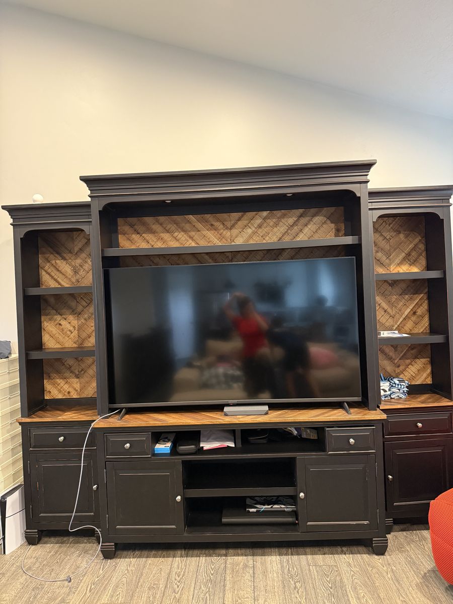 Almost new expensive and quality made entertainment center.