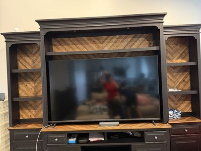 Almost new expensive and quality made entertainment center.