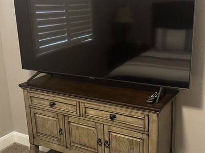 Distressed neutral color small TV stand or hallway stand