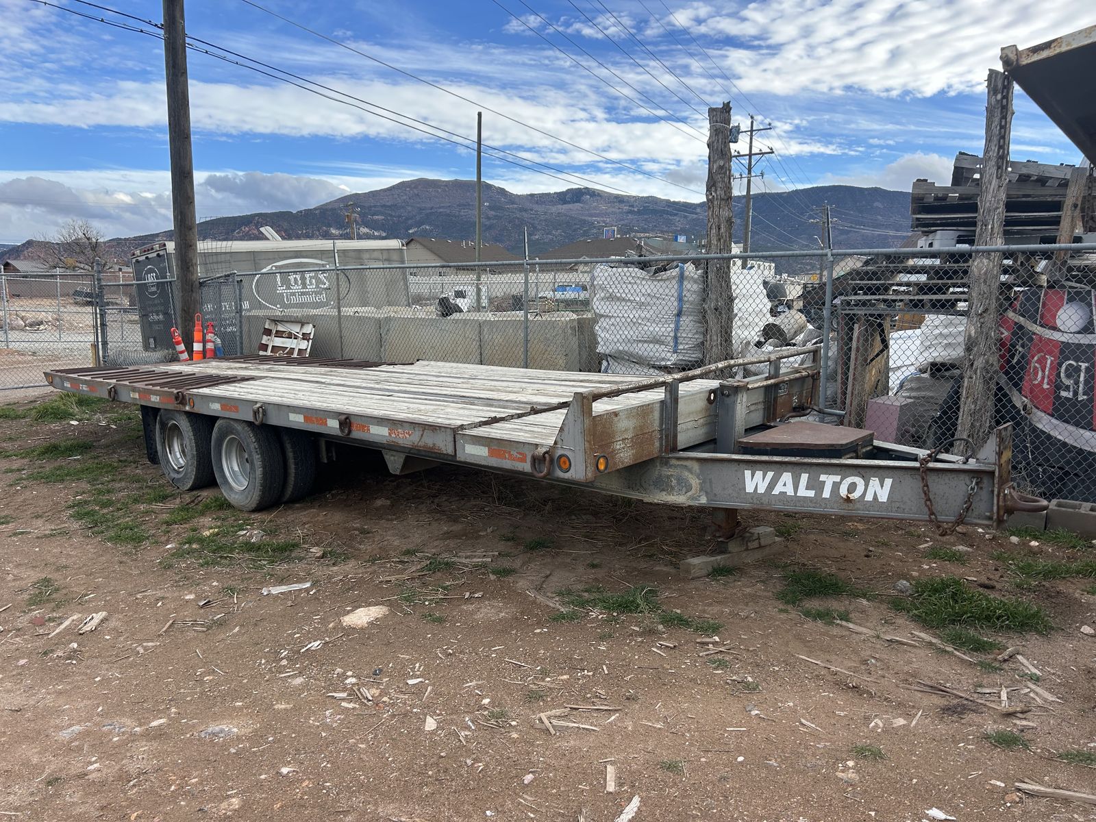 Walton 24K tilt deck equipment transport trailer for sale.
