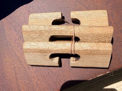 New. 3-piece wooden "double-cross" interlocking puzzle.