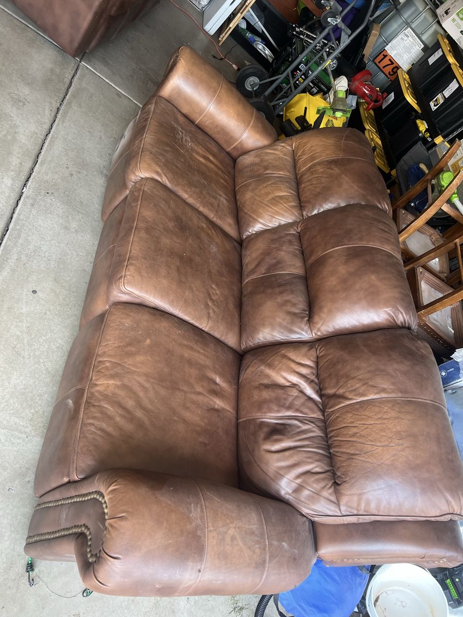 Reclining sofa and love seat. Leather. 