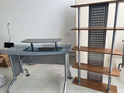 Modern metal and glass desk with matching bookshelf