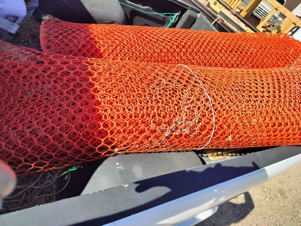 2 partial tolls of 6' orange barrier fabric