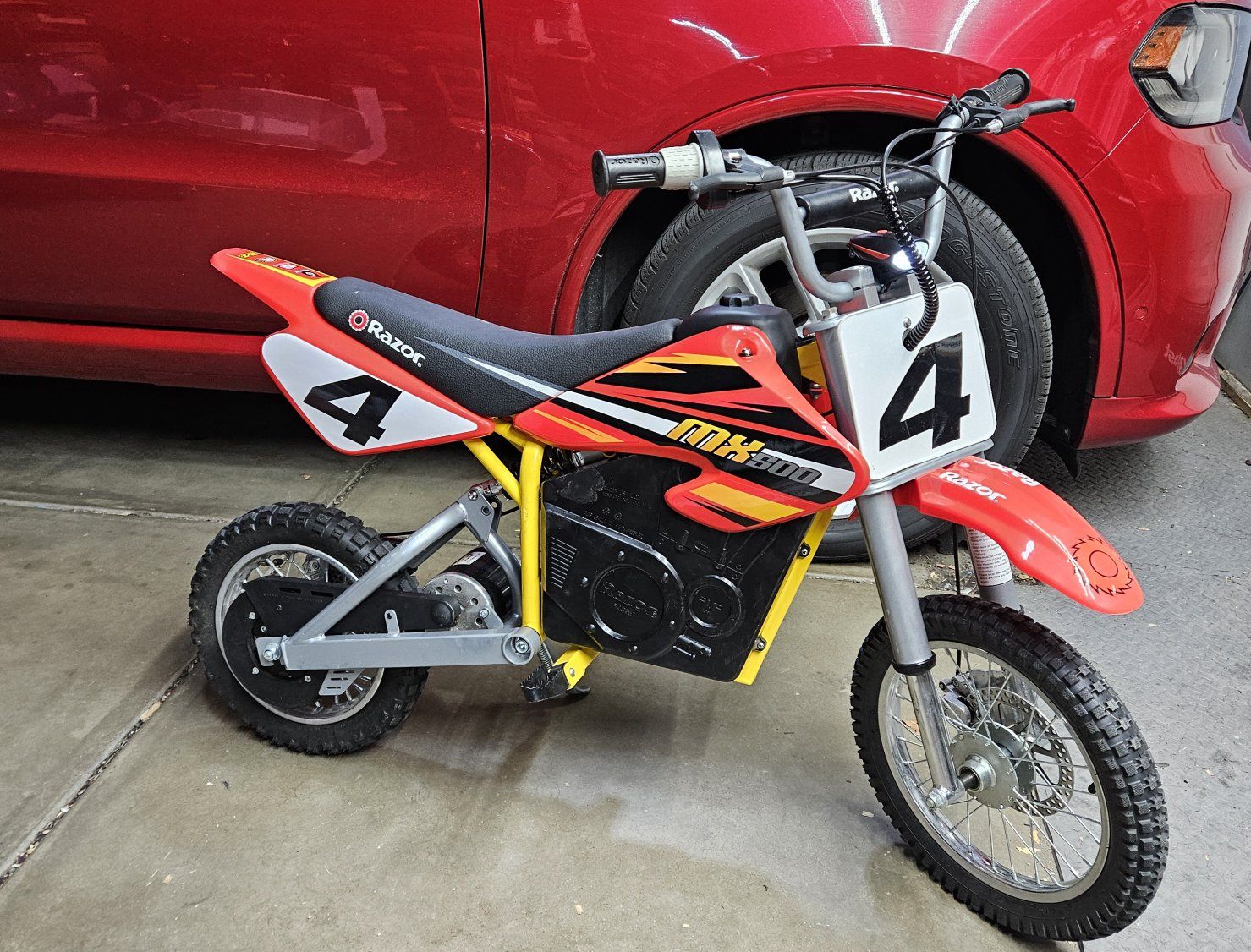 Razor MX650 with a red Mx500 new body just loved the look. NEW batteries and upgrade shock w charger lights and horn.  FIRM $550