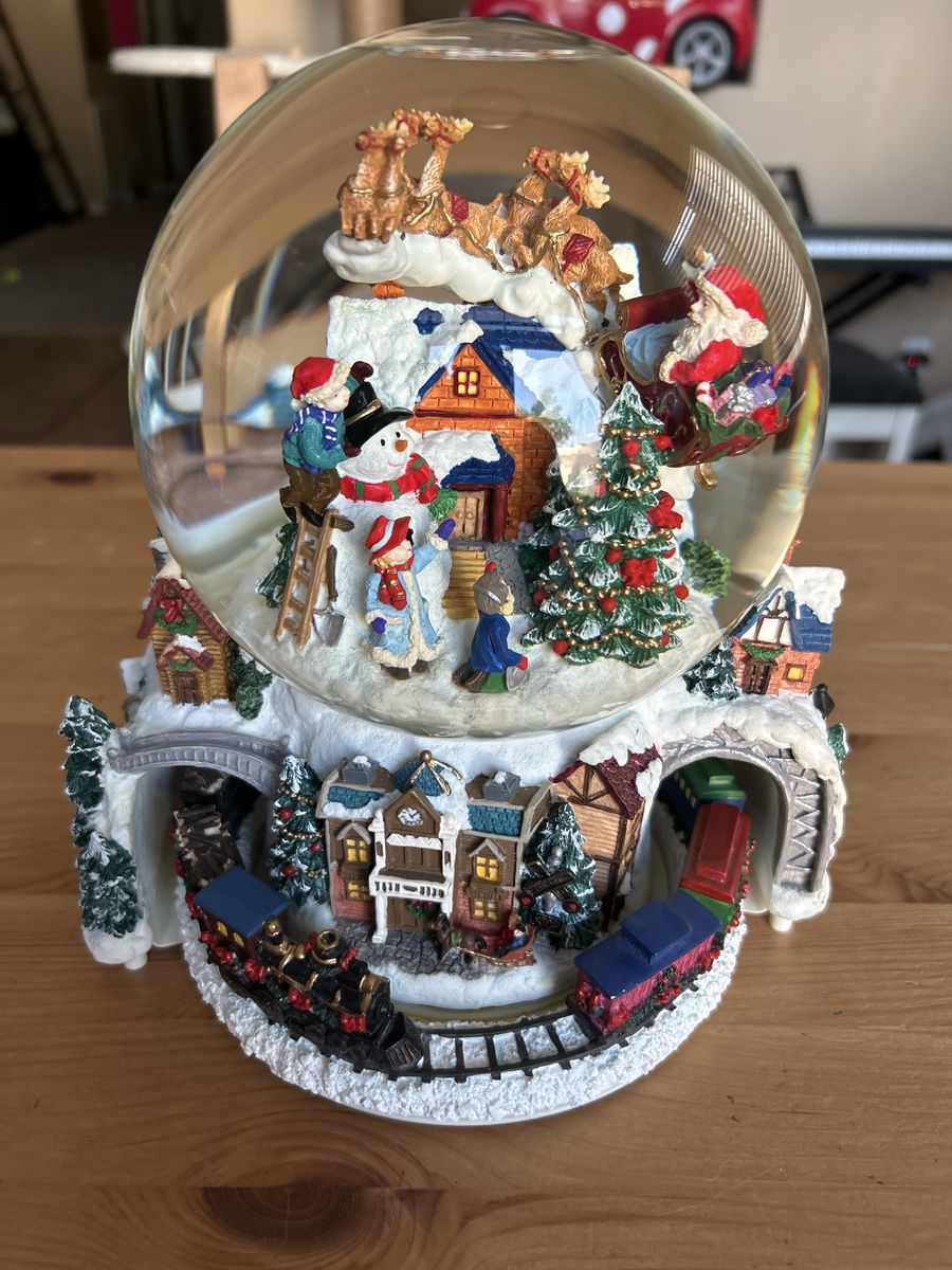 Kirkland Signature Musical Globe features revolving base with a Christmas train