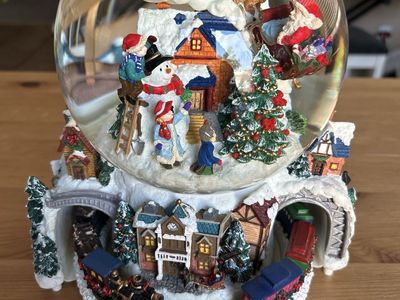 Kirkland Signature Musical Globe features revolving base with a Christmas train