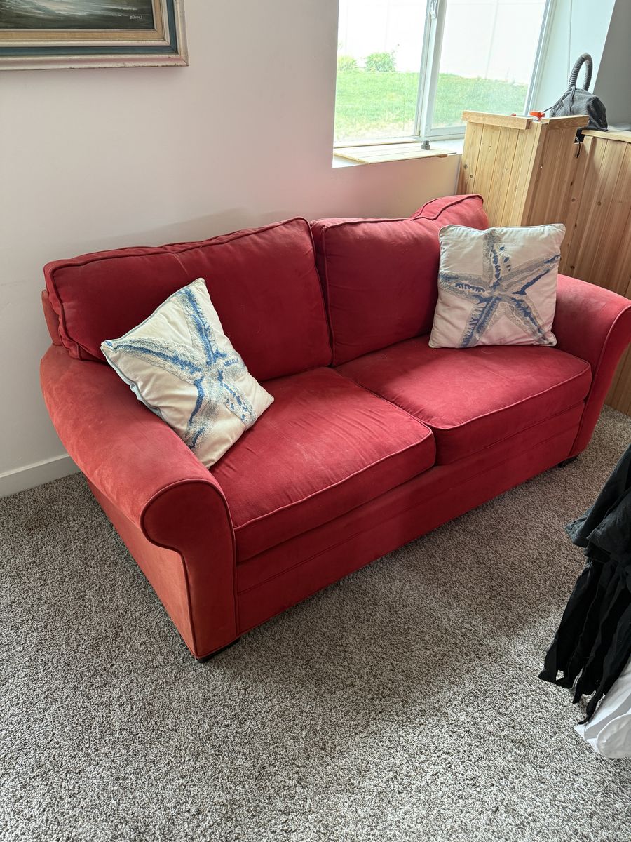 Rooms to go red sleeper sofa.  love seat size.