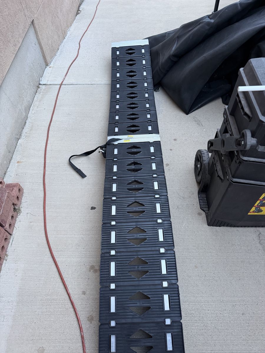 2 motorcycle, bike ramps for your truck or trailer. One of them is a Caliber ProTrax brand.