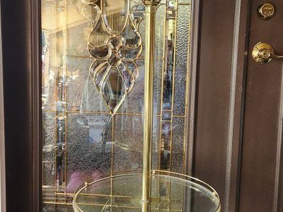 Vintage Brass Floor Lamp with Integrated Glass Table and White Shade.