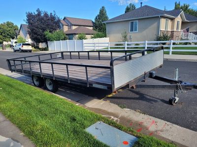 2006 Western Rec ATV/Dual Axle Utility Trailer with Wooden Deck and Rails. Model PJ816