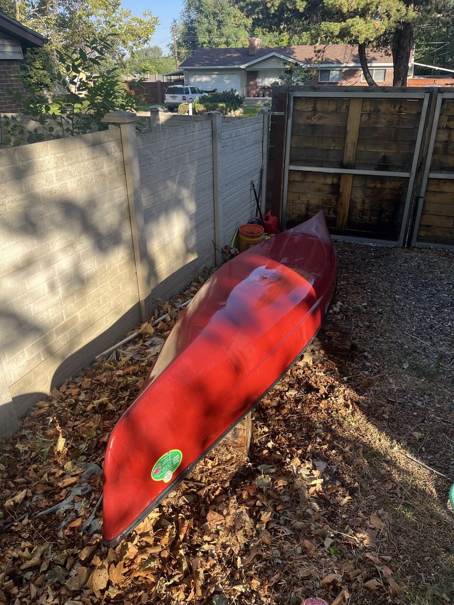 Old town Red Guide Canoe with 2 Paddles, 3 Life Vests, and Field & Stream Carrier Kit - Excellent Condition