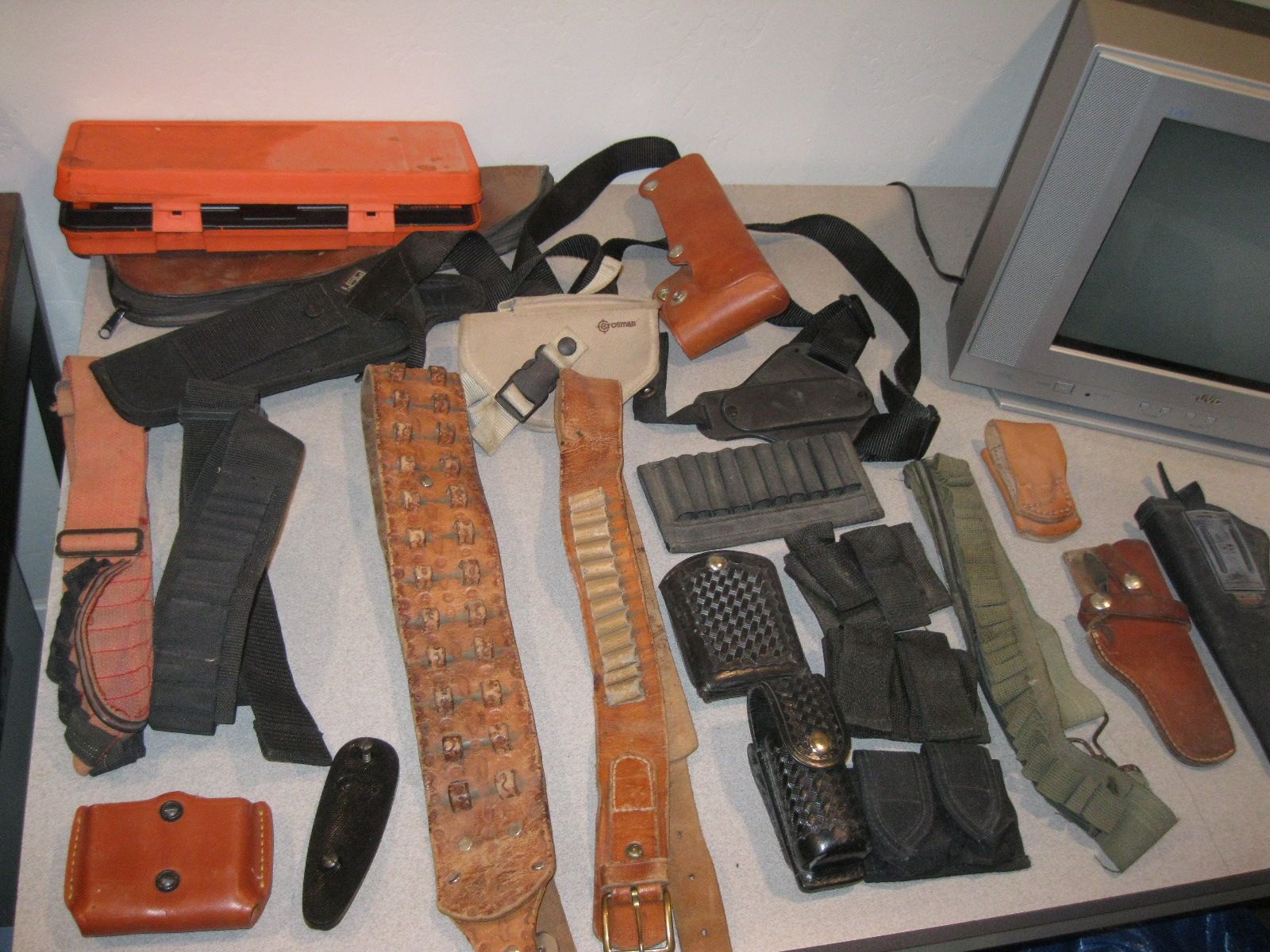 Collection of Holsters, Bandoliers, Mag Holders, and Other Gun Bits