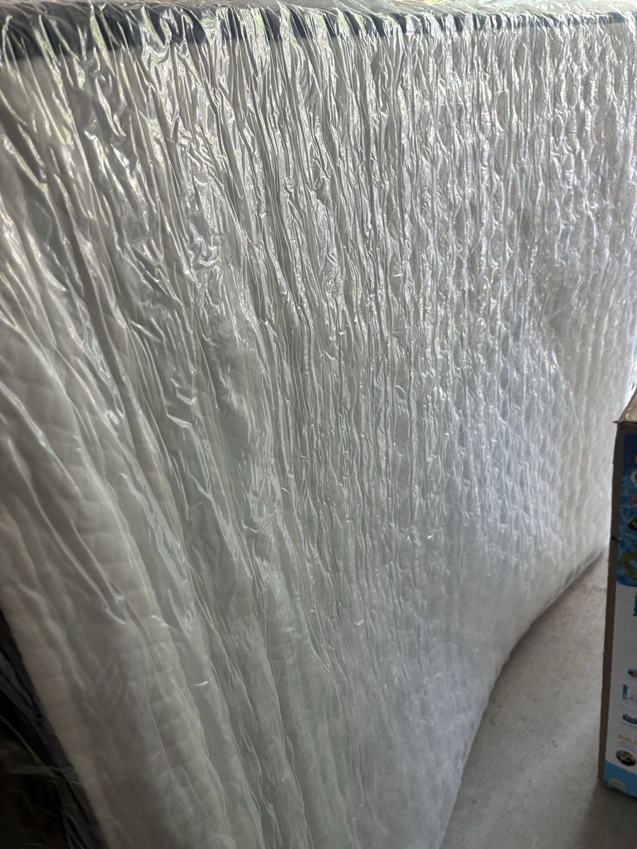 Queen size 8” thick spring mattress.  New