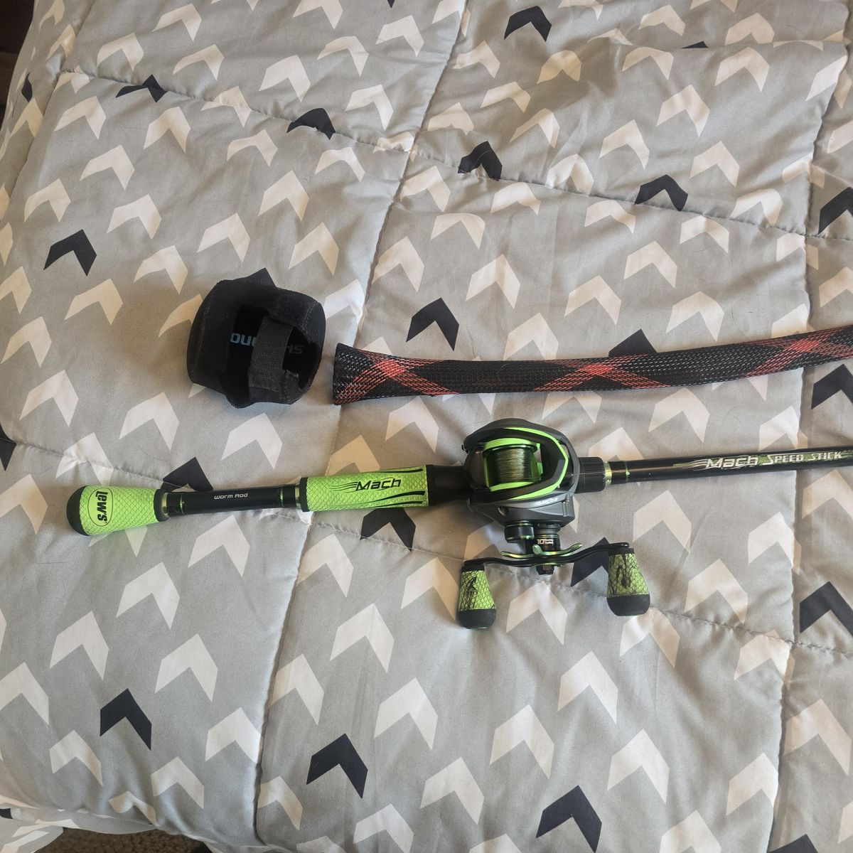 Lew's Mach 2 baitcaster with rod and reel covers